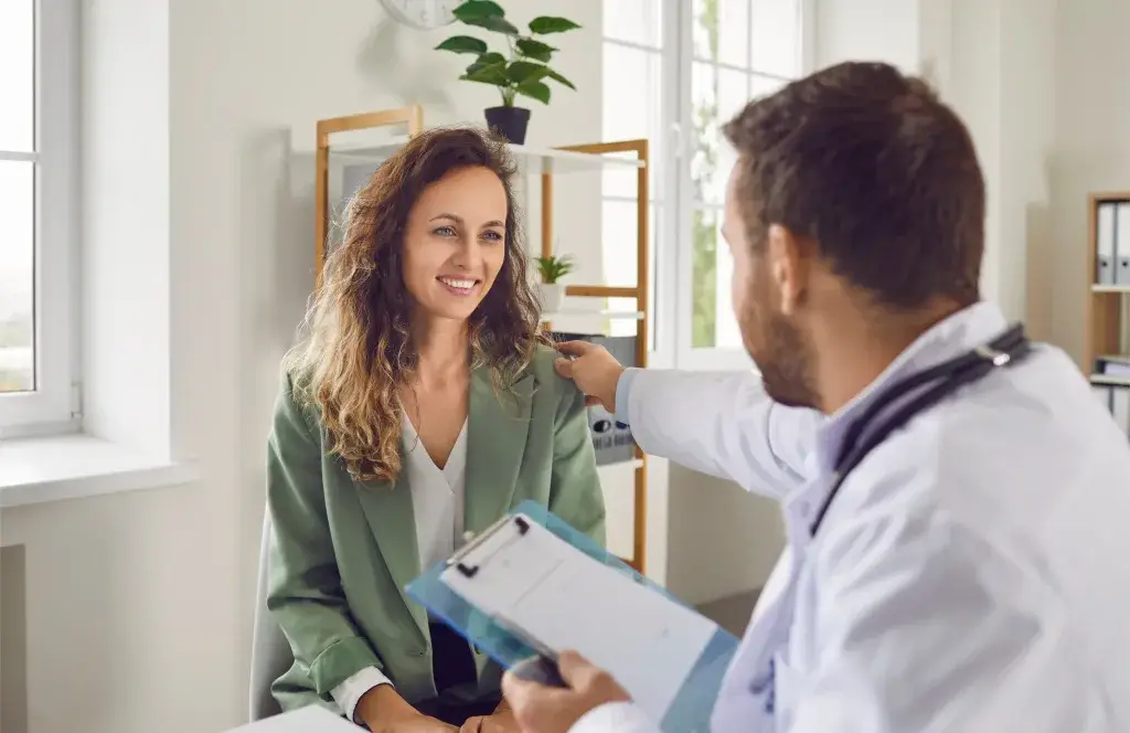 Doctor on a home visit in Malta providing sick leave verification.